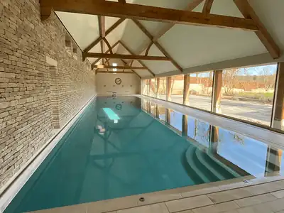 Indoor pool under an oak-framed roof