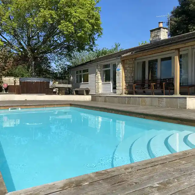 Outdoor swimming pool with a timber deck